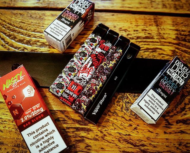 bottles of e-liquid and an e-cigarette