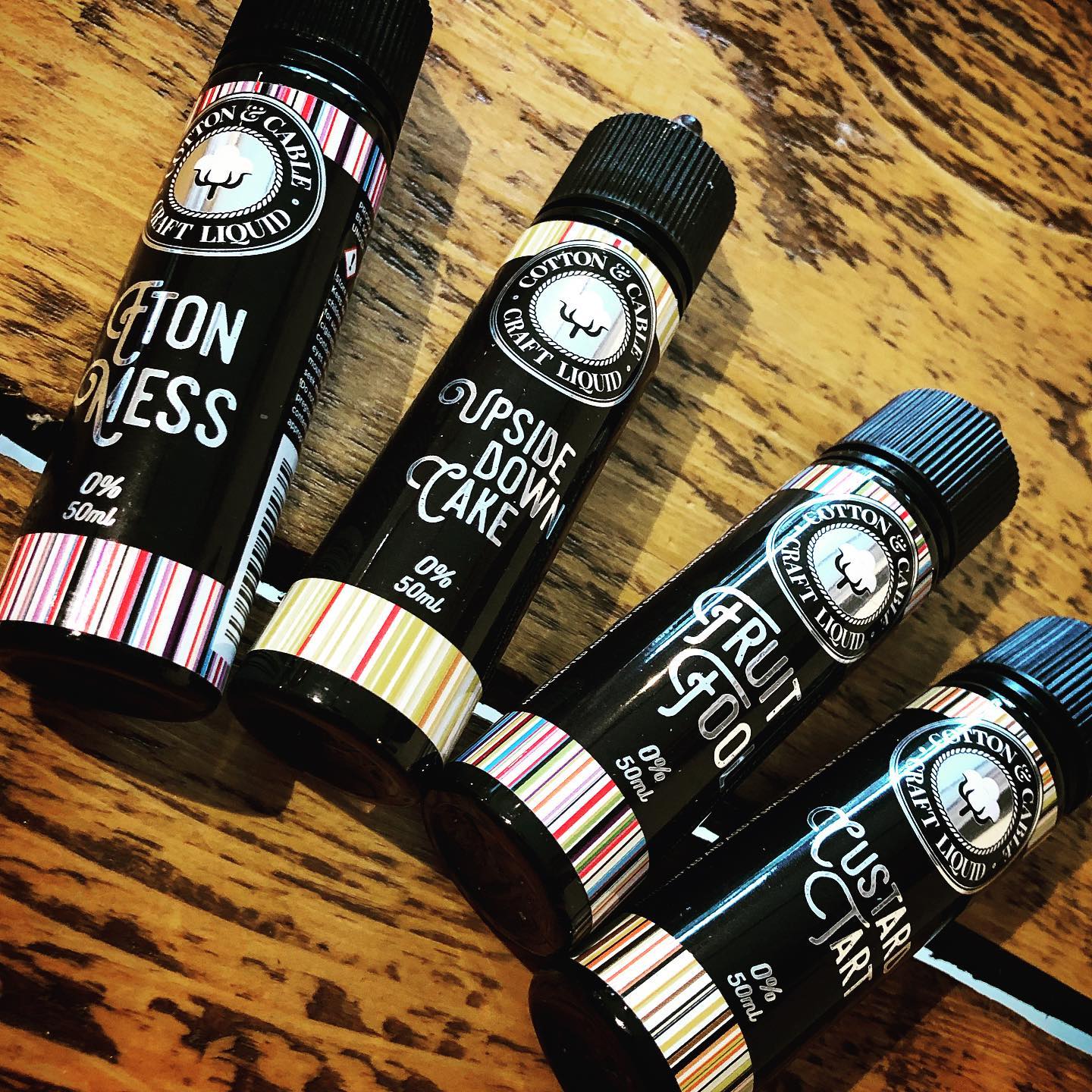 bottles of e-liquids and an electronic cigarette
